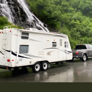 gray truck owner learning how to tow a travel trailer on a rainy day (Image: RVLIFE)