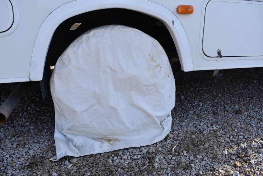 This tire cover over an RV tire protects it from UV rays. All RV tire tips should include protecting your tires from the sun.